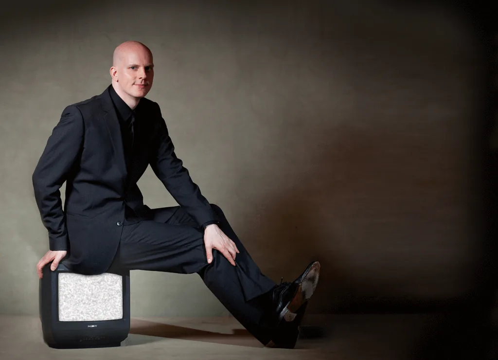 Florian Severin sitting on an old television set